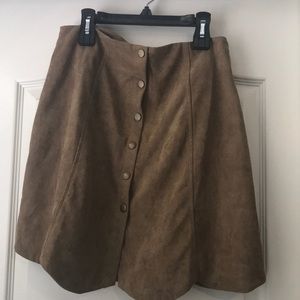 Selling a brown button down circle skirt.